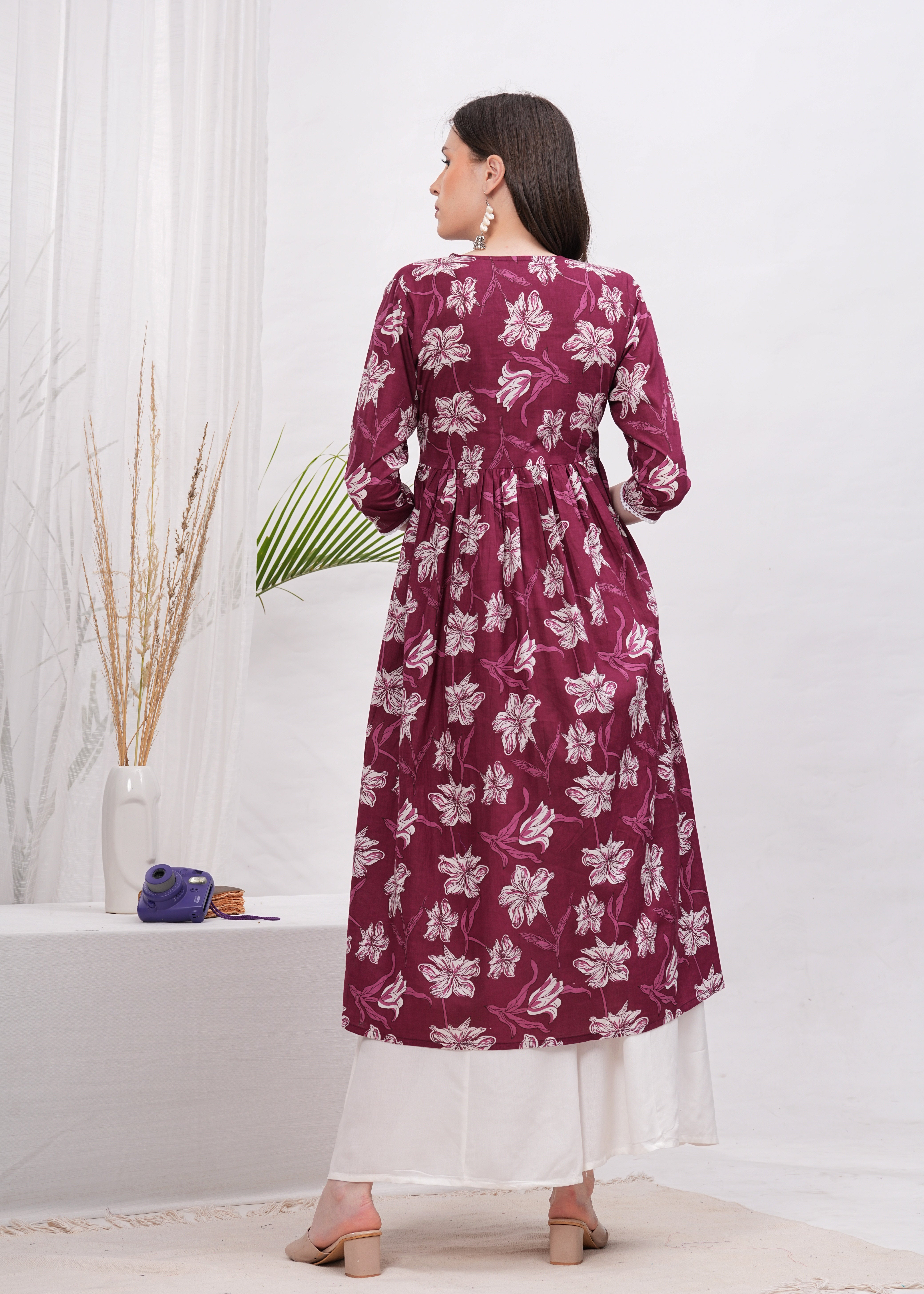 Elegant Flared Maroon Cotton Long Kurti with Artistic Prints and Stylish Neckline - Perfect Blend of Comfort and Chic Ethnic Fashion