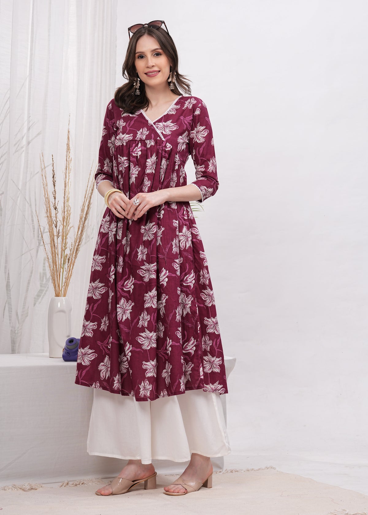 Elegant Flared Maroon Cotton Long Kurti with Artistic Prints and Stylish Neckline - Perfect Blend of Comfort and Chic Ethnic Fashion