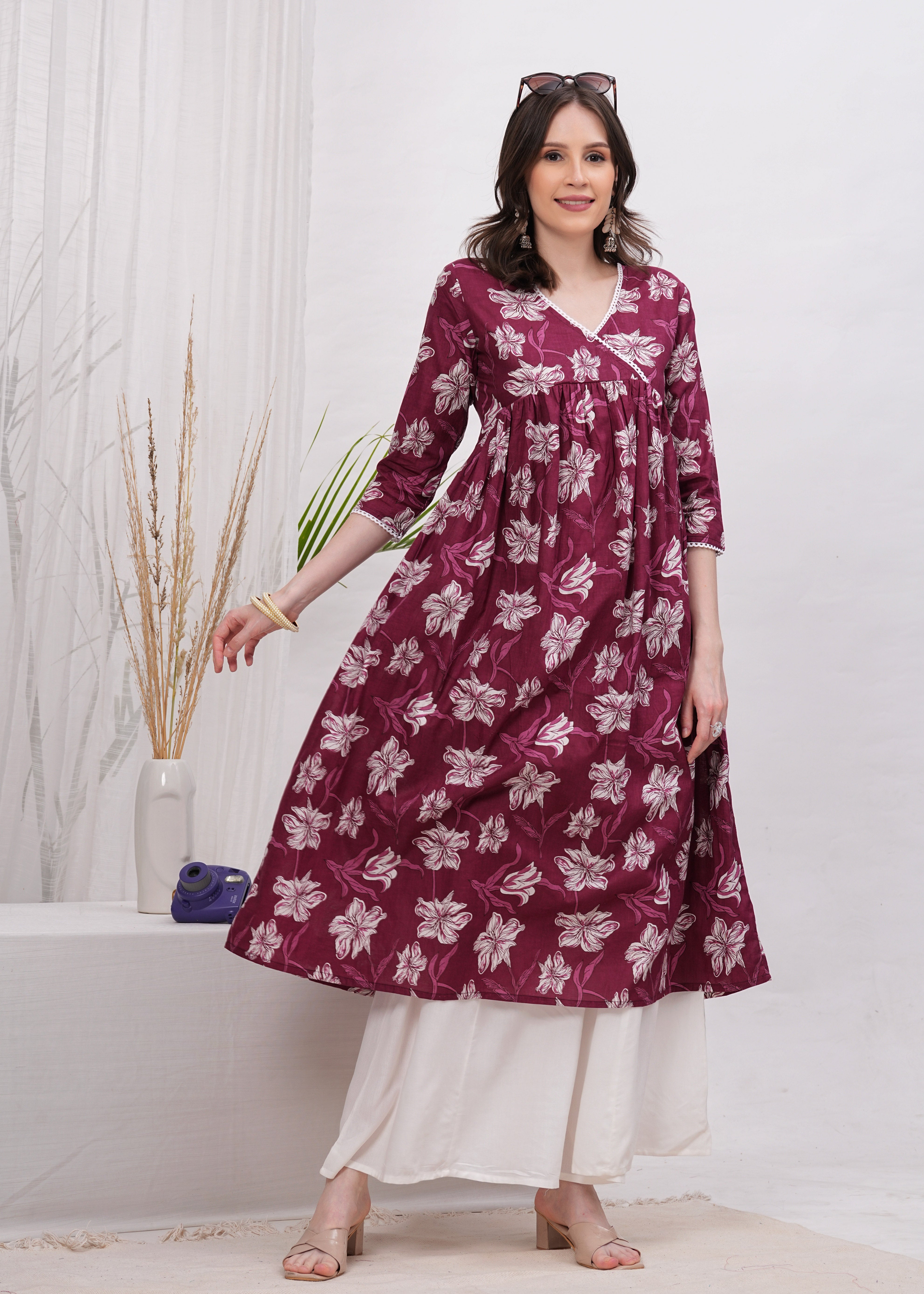 Elegant Flared Maroon Cotton Long Kurti with Artistic Prints and Stylish Neckline - Perfect Blend of Comfort and Chic Ethnic Fashion
