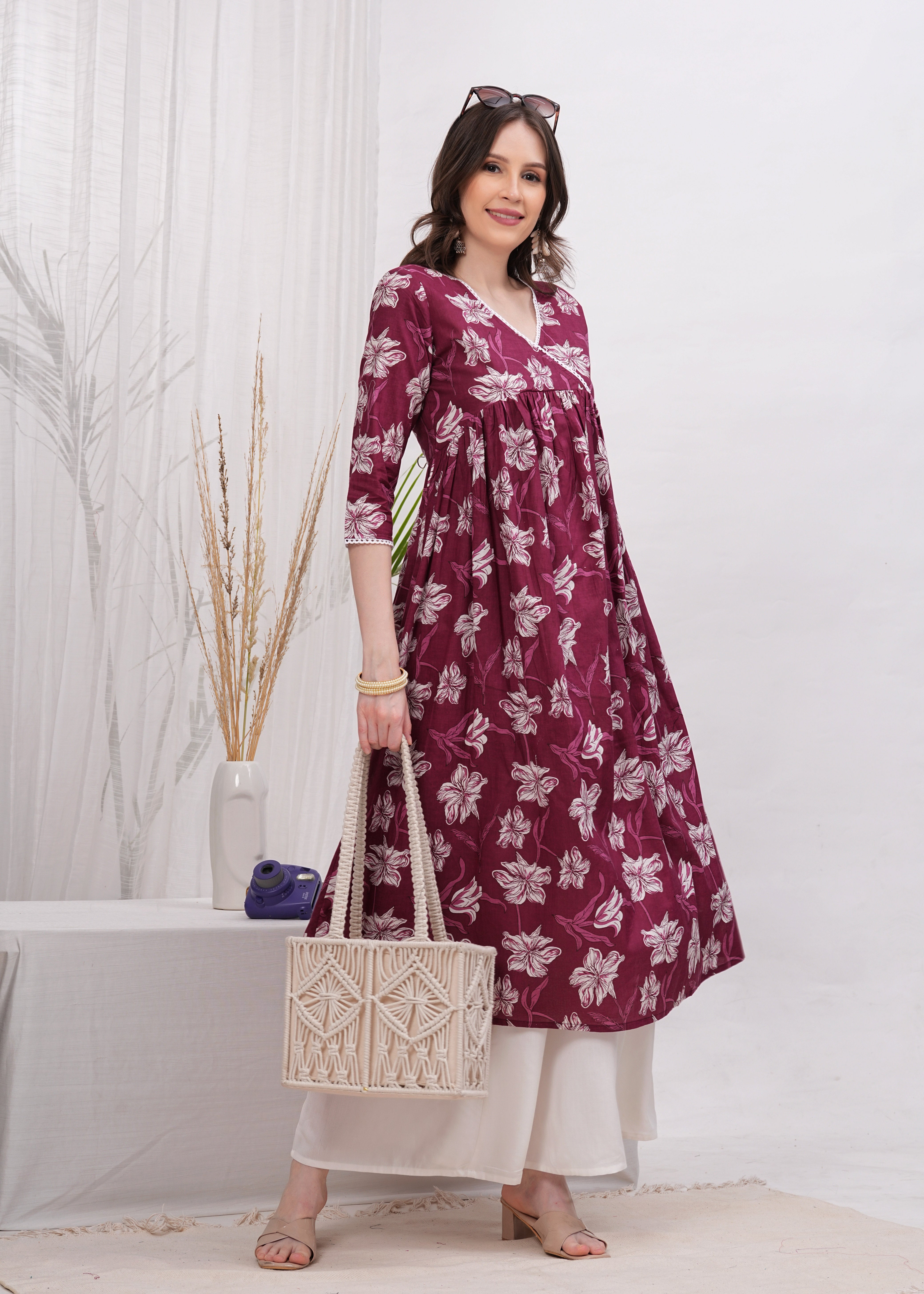 Elegant Flared Maroon Cotton Long Kurti with Artistic Prints and Stylish Neckline - Perfect Blend of Comfort and Chic Ethnic Fashion
