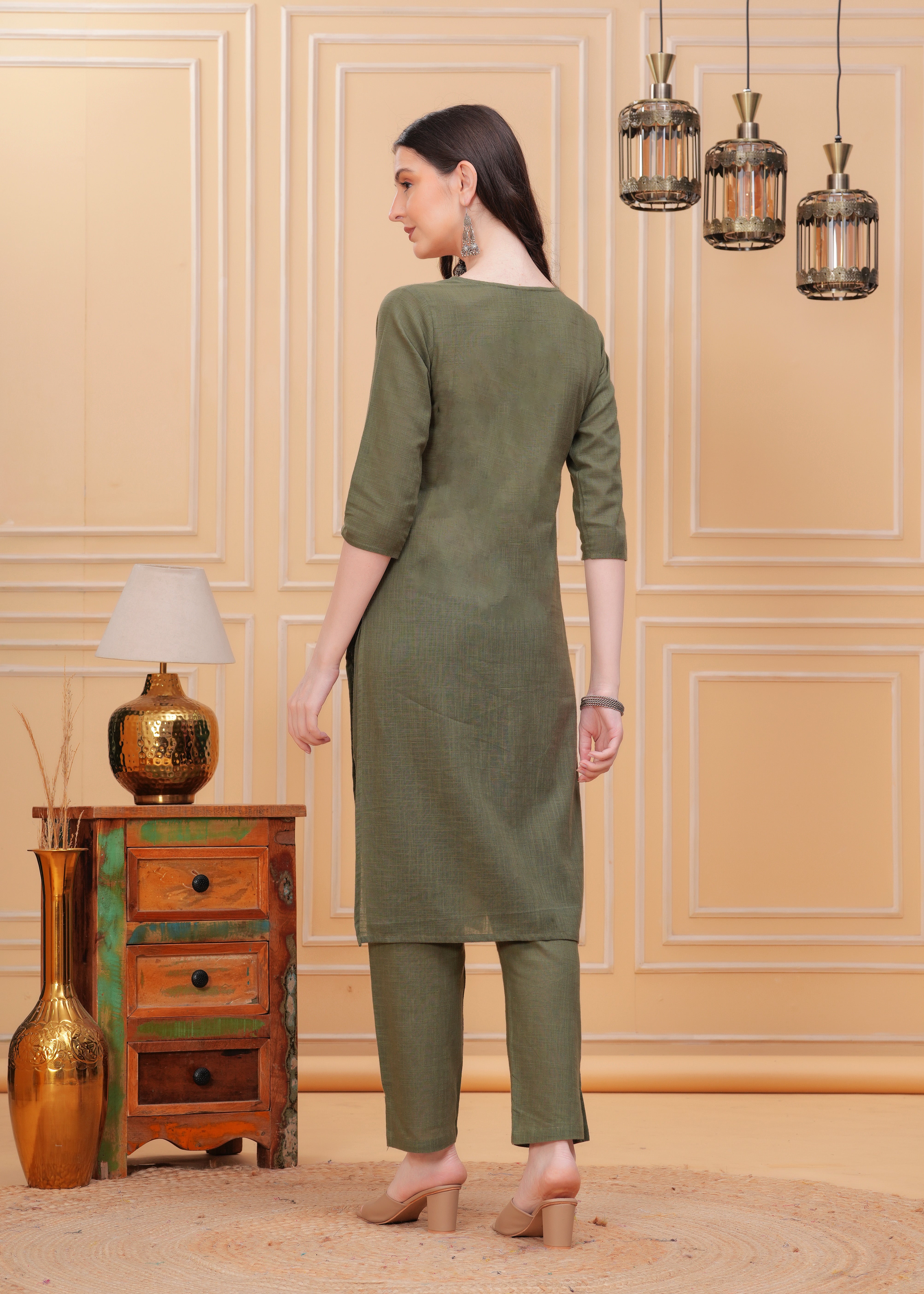 Embrace timeless elegance with our Olive Green Kurta Pant Set, a perfect blend of style and comfort